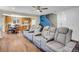 Open concept living room with eat in kitchen, dining area and hardwood floors at 9595 Elk Mountain Cir, Littleton, CO 80125