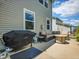 Back patio featuring a Blackstone grill, outdoor furniture, and fire pit at 9595 Elk Mountain Cir, Littleton, CO 80125