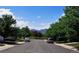 A quiet residential street with well-maintained homes and mature trees in the distance at 9595 Elk Mountain Cir, Littleton, CO 80125