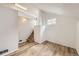 Finished basement with stairs, light walls, and floors, offering a versatile space at 8925 Oakwood St, Westminster, CO 80031
