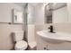 Classic bathroom featuring a toilet, sink, and shower in a compact space at 8925 Oakwood St, Westminster, CO 80031