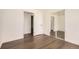 Neutral bedroom featuring hardwood floors, a sliding closet, and interior door at 8925 Oakwood St, Westminster, CO 80031