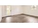 Bedroom features light hardwood floors, white walls, and access to an outdoor space at 8925 Oakwood St, Westminster, CO 80031