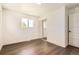 Bedroom featuring hardwood floors, closet with mirrored doors, and a window for natural light at 8925 Oakwood St, Westminster, CO 80031