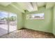 Green bedroom featuring unique tile floor and sliding glass door to deck at 8925 Oakwood St, Westminster, CO 80031