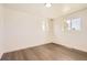 Bright bedroom with hardwood floors and a pair of windows for natural light at 8925 Oakwood St, Westminster, CO 80031