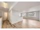 Open-concept living room featuring modern floors and access to the bathroom and bedrooms at 8925 Oakwood St, Westminster, CO 80031