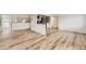 Bright living room featuring new floors and an open concept design to the kitchen at 8925 Oakwood St, Westminster, CO 80031