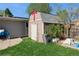 Backyard shed with side access door, providing ample space for storage, yard work, and outdoor needs at 2080 E 84Th Ave, Denver, CO 80229