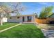 Charming single-story home with well-maintained lawn and inviting front porch area at 2080 E 84Th Ave, Denver, CO 80229
