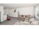 Cozy living room featuring plush carpeting and comfortable seating at 2080 E 84Th Ave, Denver, CO 80229
