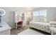 Cozy bedroom with a stylish desk and bed creates an inviting and functional space perfect for relaxation and study at 3074 Kestrel St, Brighton, CO 80601
