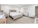 Elegant bedroom featuring a tufted headboard bed, matching dresser, and a cozy rocking chair at 3074 Kestrel St, Brighton, CO 80601
