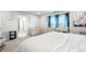 Bright bedroom with blue drapes and white accents offers a cheerful retreat and functional furnishings at 3074 Kestrel St, Brighton, CO 80601