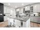 Bright kitchen with granite countertops, stainless steel appliances, and a center island at 3074 Kestrel St, Brighton, CO 80601