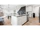 Open concept kitchen featuring a large island, granite counters, and stainless steel appliances at 3074 Kestrel St, Brighton, CO 80601