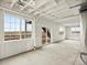 Bright, unfinished basement featuring large windows and a sliding glass door to the backyard at 17120 E 90Th Pl, Commerce City, CO 80022