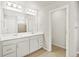 This bathroom has double sinks, tile floors, a shower, and white cabinets at 17120 E 90Th Pl, Commerce City, CO 80022