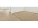 Neutral bedroom with tan carpet, white walls and light colored hardwood flooring outside doorway at 17120 E 90Th Pl, Commerce City, CO 80022