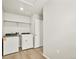Laundry room with full-sized washer and dryer and overhead shelving at 17120 E 90Th Pl, Commerce City, CO 80022