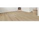 Living room with light hardwood flooring and gas fireplace at 17120 E 90Th Pl, Commerce City, CO 80022