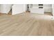 Open floor plan features light hardwood flooring with access to the kitchen and carpeted stairs at 17120 E 90Th Pl, Commerce City, CO 80022