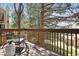 Relaxing back deck offers outdoor seating with scenic treetop views and a nature filled vista at 1470 S Quebec Way # 83, Denver, CO 80231