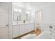 Stylish bathroom with double vanity, modern fixtures, and tiled flooring at 1470 S Quebec Way # 83, Denver, CO 80231