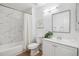 Bathroom with tub/shower combo with white marble tile at 1470 S Quebec Way # 83, Denver, CO 80231