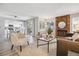 Stylish living area seamlessly flows into a modern kitchen, offering comfortable seating and a fireplace at 1470 S Quebec Way # 83, Denver, CO 80231