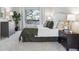 Cozy main bedroom with plush carpeting, natural lighting, and a private balcony at 1470 S Quebec Way # 83, Denver, CO 80231