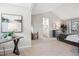 Bright main bedroom with vaulted ceiling, neutral decor, and ensuite bathroom at 1470 S Quebec Way # 83, Denver, CO 80231