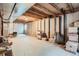 Unfinished basement ready for customization with exposed ceiling beams and concrete flooring, offering a blank canvas at 9615 Lansing Cir, Commerce City, CO 80022