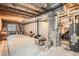 Spacious unfinished basement with exposed ceiling, a water heater, and ample room for storage or customization at 9615 Lansing Cir, Commerce City, CO 80022