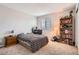 Cozy bedroom with a comfortable bed, a desk area for work, and a bookcase with plenty of storage at 9615 Lansing Cir, Commerce City, CO 80022