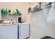 Functional laundry room featuring a side by side washer and dryer, and shelves for storage solutions at 9615 Lansing Cir, Commerce City, CO 80022