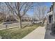 A charming street view of the neighborhood with a well-maintained lawn and curb appeal at 9615 Lansing Cir, Commerce City, CO 80022