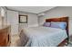 Cozy bedroom featuring a plush queen bed, closet, and lots of natural light at 5071 S Boston St, Greenwood Village, CO 80111