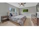 Comfortable bedroom features soft carpet, ceiling fan and great natural light at 5071 S Boston St, Greenwood Village, CO 80111