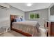 Cozy bedroom features a plush bed, dresser, and a large window letting in natural light for a relaxing atmosphere at 5071 S Boston St, Greenwood Village, CO 80111