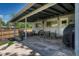 Relaxing covered patio with comfortable seating, a ceiling fan, and a grill for outdoor cooking at 5071 S Boston St, Greenwood Village, CO 80111