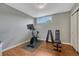 Finished basement exercise room with wood floor and window at 5071 S Boston St, Greenwood Village, CO 80111