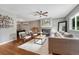 Cozy living room featuring a fireplace, stylish seating, and hardwood floors, creating a warm ambiance at 5071 S Boston St, Greenwood Village, CO 80111