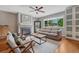 Comfortable living room with a fireplace, large window, and ample seating, ideal for Gathering gatherings at 5071 S Boston St, Greenwood Village, CO 80111