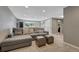 Spacious carpeted living room includes comfortable seating, recessed lighting, and a neutral color palette at 5071 S Boston St, Greenwood Village, CO 80111