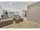 Spacious basement living room featuring carpet, neutral walls, recessed lighting, and a gray sectional sofa at 5071 S Boston St, Greenwood Village, CO 80111