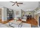 Bright living room featuring stylish furniture, hardwood floors, and open access to the dining area at 5071 S Boston St, Greenwood Village, CO 80111