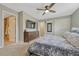 Spacious main bedroom offers storage with a dresser, television, dual closets, and access to an ensuite bathroom at 5071 S Boston St, Greenwood Village, CO 80111