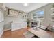 Well-lit home office featuring wood floors, neutral walls, a built-in cabinet and modern workspace at 5071 S Boston St, Greenwood Village, CO 80111