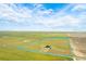 An aerial shot shows the boundary of this substantial property in relation to its surrounding landscape at 11680 Imboden Rd, Hudson, CO 80642
